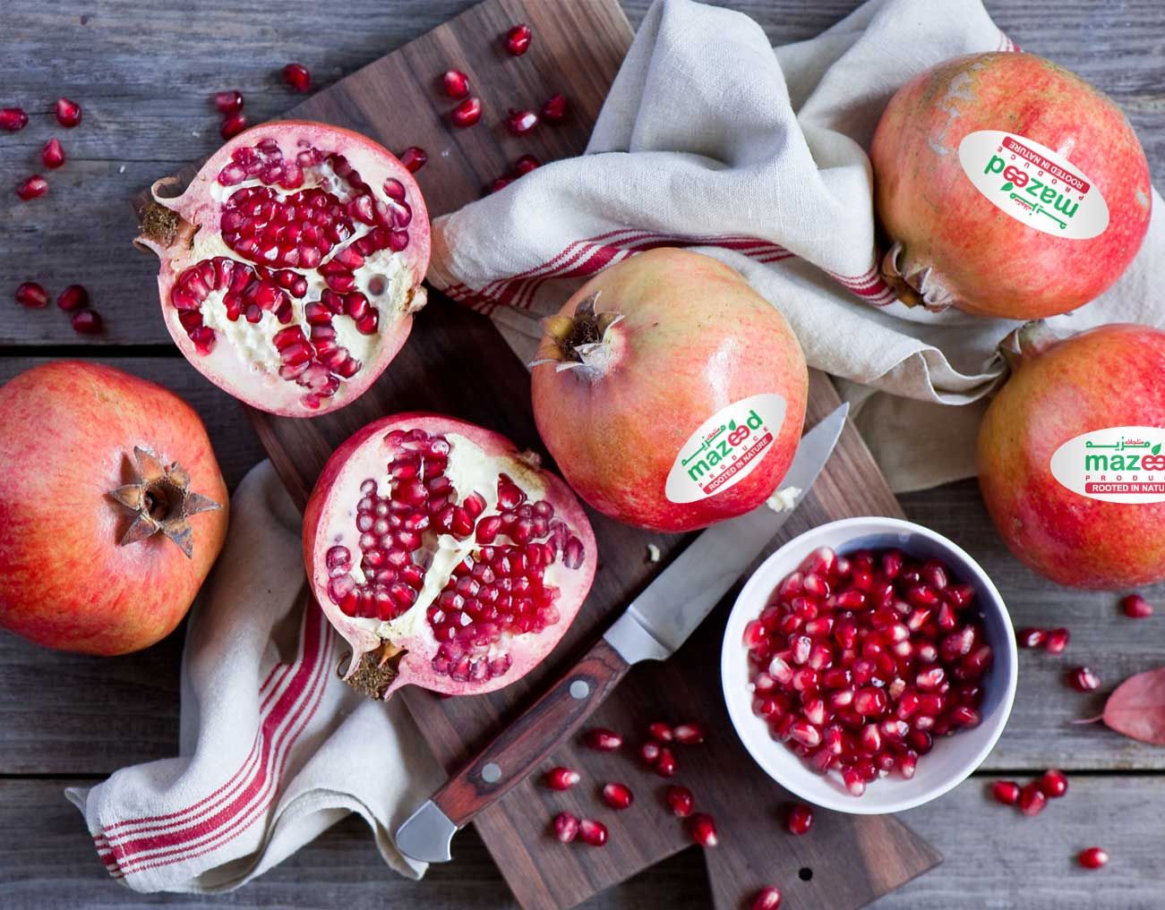 Wonderful pomegranates cut open on a board